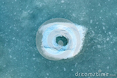 Round pattern on river ice from snow Stock Photo