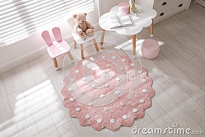 Round pink rug on floor in children`s room Stock Photo