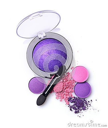 Round purple crashed eyeshadow for makeup as sample of cosmetics product with applicator Stock Photo