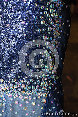 Round sequins on a dress blue evening. Details. Fragment Stock Photo