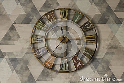 round-shaped clock with an unusual design Stock Photo