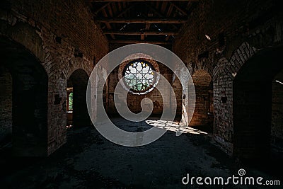 Round stained glass window in old abandoned castle Stock Photo