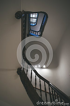 round staircase of an unusual, interesting shape in an old house Stock Photo