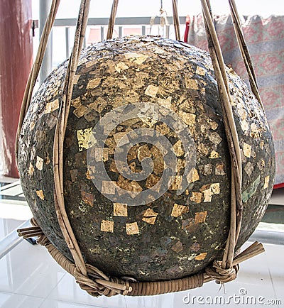 Round stones buried in the ground to mark the sacred limits of a thai temple call look nimit Stock Photo