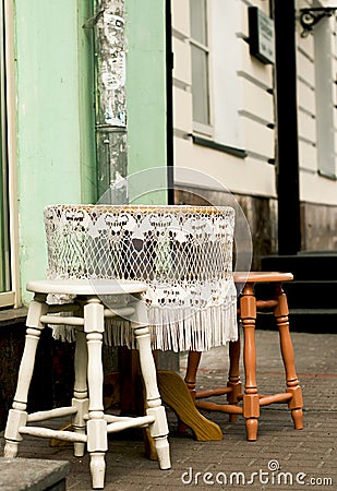 Round table with white lace tablecloth Stock Photo