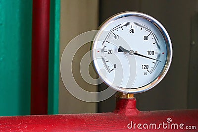 Round temperature sensor on the hot water pipe Stock Photo