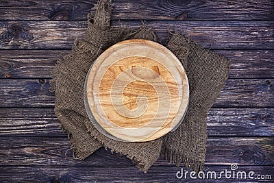 Round tray for pizza on dark wooden table. Top view. Copy space. Stock Photo