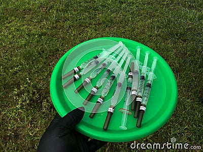 Round tray with syringes Stock Photo
