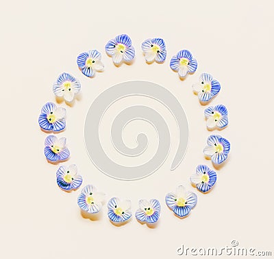 Round vintage frame made of small blue flowers on a white background with space for text Stock Photo