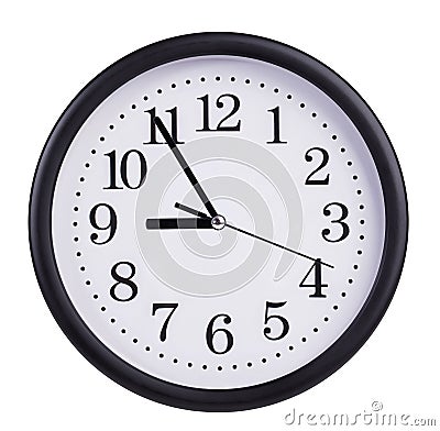 Round wall clock shows five to nine Stock Photo