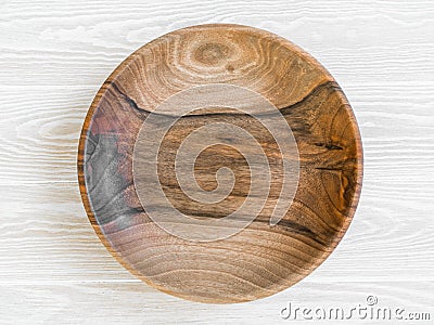 Round wooden craft plate mockup for eco, food or beauty product on white wood table Stock Photo