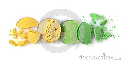 Round yellow and green crashed eyeshadow for make up as sample of cosmetic product Stock Photo