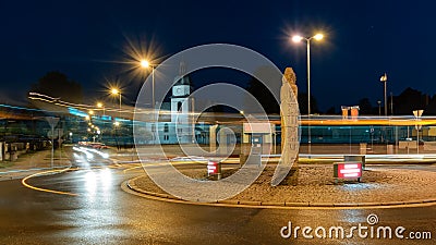 Roundabout and the church in Zory in the evening Stock Photo