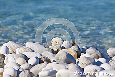 Rounded white stones with fresh transparent water Stock Photo