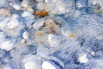 Rounded white stones under fresh transparent water Stock Photo
