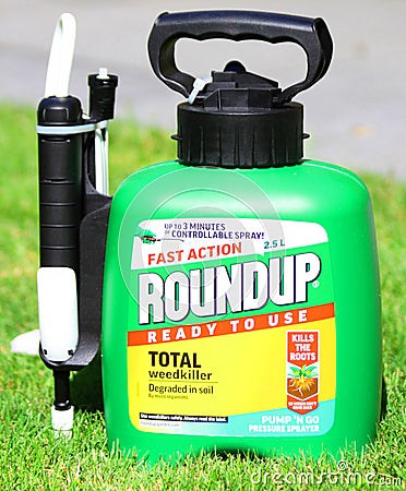 RoundUp in garden. RoundUp is a brand of herbicide containing glyphosate by Monsanto Company Editorial Stock Photo