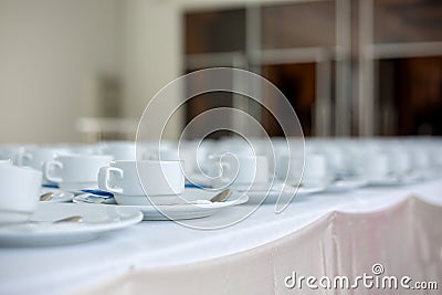 roup of empty Many rows of white ceramic coffee or tea cups Stock Photo