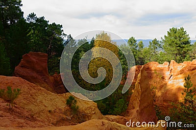 Roussillon. Martian landscape of ocher hills. Sentier des Ocres Editorial Stock Photo