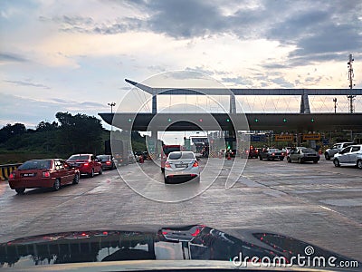 The route enters the toll road. The incoming vehicles are separated according to the category and type of payment to be made. Editorial Stock Photo