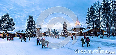 Rovaniemi - December 16, 2017: Travelers in the Santa Claus village of Rovaniemi, Finland Editorial Stock Photo
