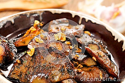 rovellons or niscalos, typical autumn mushrooms of Spain, sauteed with garlic and parsley Stock Photo