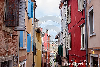 Rovinj, Croatia; 7/18/2019: Picturesque narrow street with colorful facades of the houses Editorial Stock Photo