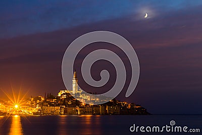 Rovinj old town at night with moon on the colorful sky, Adriatic sea coast of Croatia, Europe Stock Photo