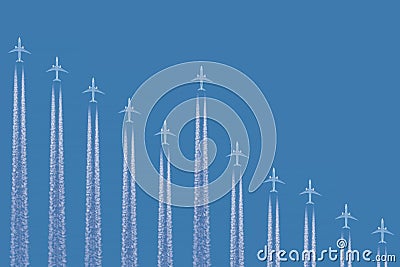 Row of airplanes in blue sky positioned as a negative graph chart Stock Photo