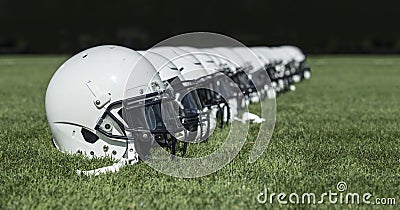 Row of American football Helmets before a game Stock Photo