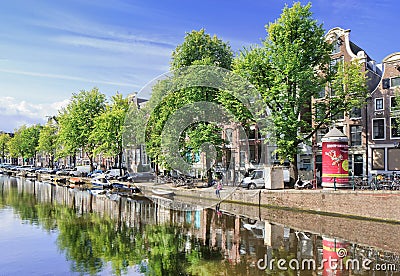 Row of ancient renovated mansions near a canal, Amsterdam, Netherlands Editorial Stock Photo