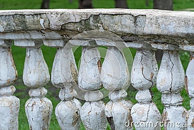 Row of ancient stone railings in city park close up. Ruined long of period. Stock Photo