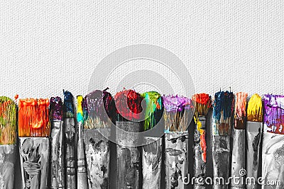 Row of artist paintbrushes with colorful bristle closeup Stock Photo