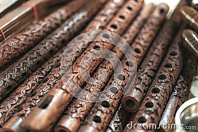 Row of Bansuri, traditional flute instrument from India Stock Photo