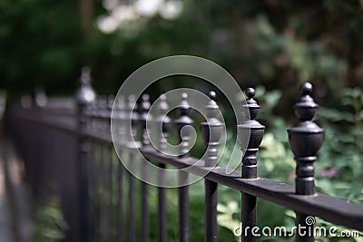 Row of Beautiful Black Finials on a Black Metal Fence Stock Photo