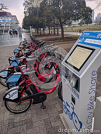 Row of bikes for rent, bike share kiosk Editorial Stock Photo