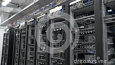 Device for mining crypto currency. Row of bitcoin miners set up on the wired shelfs. Mining cryptocurrency. Bitcoin farm Stock Photo