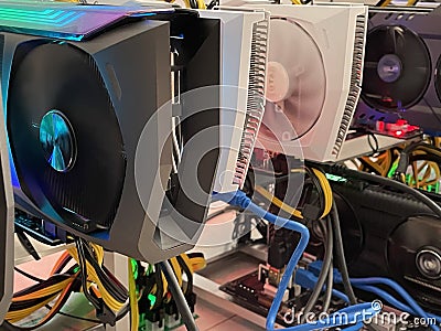 Row of bitcoin miners set up on the wired shelfs. Device for mining crypto currency. Mining cryptocurrency. Bitcoin farm Stock Photo
