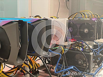 Row of bitcoin miners set up on the wired shelfs. Device for mining crypto currency. Mining cryptocurrency. Bitcoin farm Stock Photo