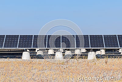 A row of blue solar panels Stock Photo