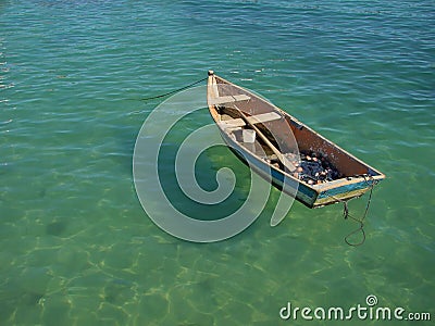 Row boat floating on the water Stock Photo