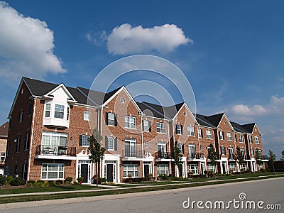 Row of Brick Condos With Bay Windows Stock Photo