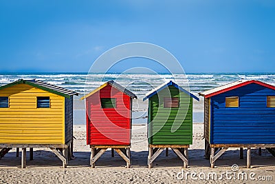 Row of brightly colored huts in Muizenberg beach. Muizenberg Stock Photo