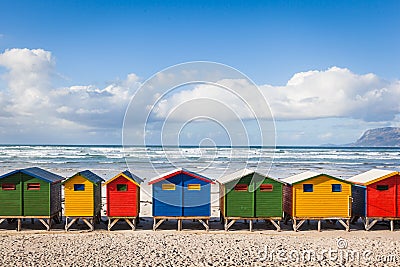 Row of brightly colored huts in Muizenberg beach. Muizenberg Stock Photo