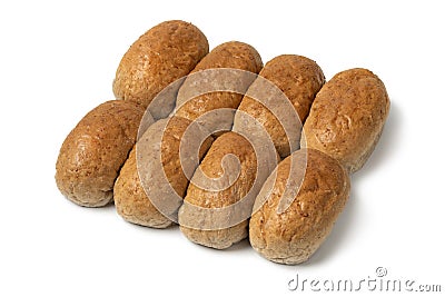 Row of of brown whole grain buns of bread close up on white background Stock Photo