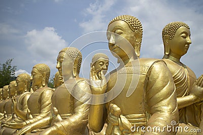 Row of Buddhist disciple statues Stock Photo