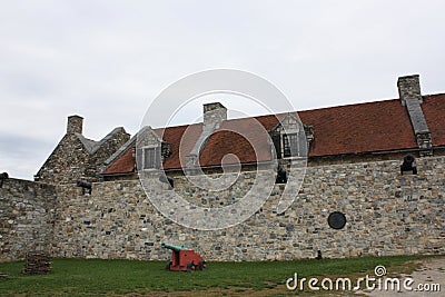 Row of canons in outer wall with buildings in the background of Fort Ticonderoga in Ticonderoga, New York Editorial Stock Photo