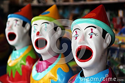 Row of carnival clowns Stock Photo