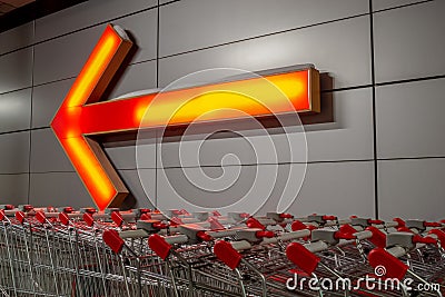 Row of carts on the street, next to the store. In the background a large pointer Stock Photo