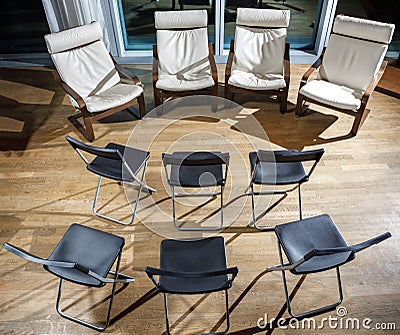 A row of chairs and armchairs facing each other. The concept of full-time training. Coaching. Stock Photo