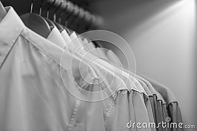 Row of clean new orderly cloth in wardrobe urban people lifestyle Stock Photo